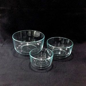 Set of three (3) aqua Pyrex bowls.